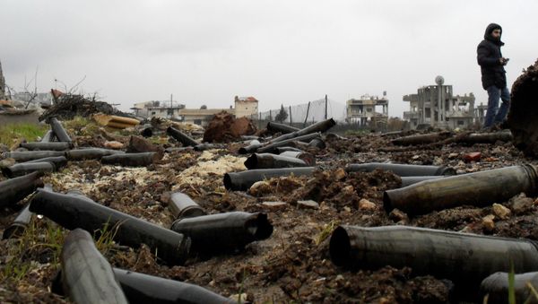 A picture taken on January 26, 2016 shows artillery casings on the ground after Syrian pro-government forces retook the town of Sheikh Miskeen in southern Daraa province from rebel forces A picture taken on January 26, 2016 shows artillery casings on the ground after Syrian pro-government forces retook the town of Sheikh Miskeen in southern Daraa province from rebel forces - Sputnik International