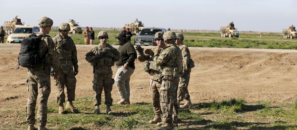 US-led coalition instructors monitor as they train Iraqi soldiers from the army's 72nd infantry brigade while participating in a joint live ammunition exercise at Besmaya military base in south of Baghdad, Iraq, January 27, 2016. US-led coalition instructors monitor as they train Iraqi soldiers from the army's 72nd infantry brigade while participating in a joint live ammunition exercise at Besmaya military base in south of Baghdad, Iraq, January 27, 2016. - Sputnik International