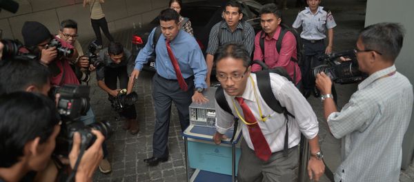 File Photo: Malaysian police seize equipment from the 1Malaysia Development Berhad (1MDB) office in Kuala Lumpur on July 8, 2015 File Photo: Malaysian police seize equipment from the 1Malaysia Development Berhad (1MDB) office in Kuala Lumpur on July 8, 2015 - Sputnik International