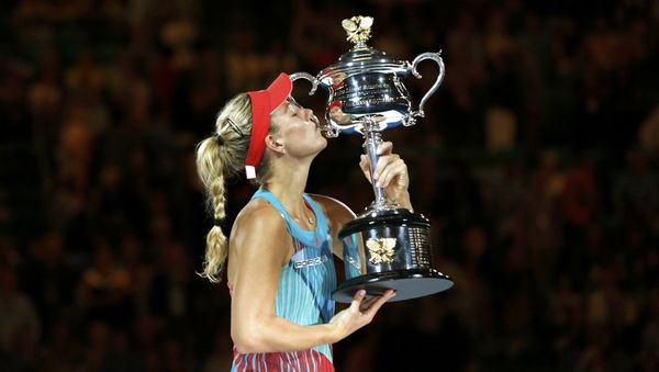 Germany's Angelique Kerber kisses the trophy after winning her final match against Serena Williams of the U.S. at the Australian Open tennis tournament at Melbourne Park, Australia, January 30, 2016 - Sputnik International