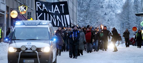 Anti-immigration marchers are led by a police van on the streets in Tampere, Finland January 23, 2016 Anti-immigration marchers are led by a police van on the streets in Tampere, Finland January 23, 2016 - Sputnik International