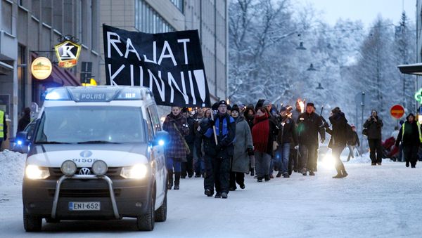 Anti-immigration marchers are led by a police van on the streets in Tampere, Finland January 23, 2016 Anti-immigration marchers are led by a police van on the streets in Tampere, Finland January 23, 2016 - Sputnik International