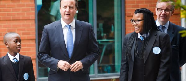 Britain's Prime Minister David Cameron (2-L) and Secretary of State for Education Michael Gove (R) walk with students during the opening of the Perry Beeches III Free School in Birmingham on September 3, 2013 Britain's Prime Minister David Cameron (2-L) and Secretary of State for Education Michael Gove (R) walk with students during the opening of the Perry Beeches III Free School in Birmingham on September 3, 2013 - Sputnik International
