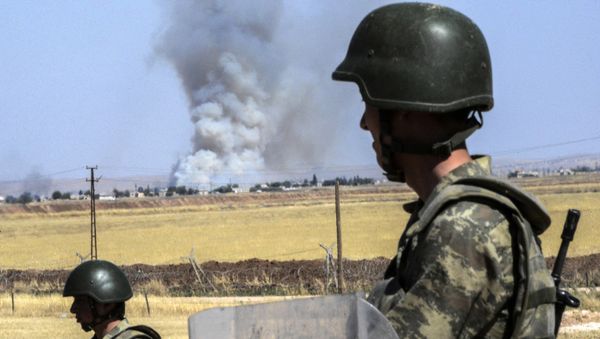 Turkish soldiers stand guard by the border with Syria Turkish soldiers stand guard by the border with Syria - Sputnik International