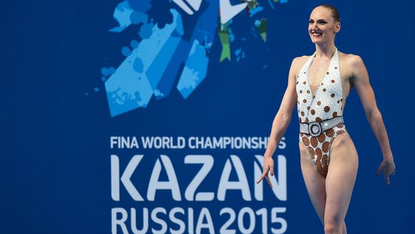 Svetlana Romashina of Russia performs her technical program during the synchronized swimming competition at the 2015 FINA World Championships in Kazan - Sputnik International