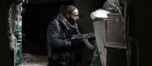 A fighter from the Jaish al-Islam (Islam Army), the foremost rebel group in Damascus province guards a position on the front line in Jobar, on the eastern edge of the Syrian capital A fighter from the Jaish al-Islam (Islam Army), the foremost rebel group in Damascus province guards a position on the front line in Jobar, on the eastern edge of the Syrian capital - Sputnik International