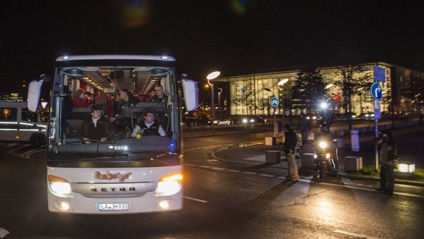 A bus carrying refugees with asylum status in Germany leaves the chancellery in Berlin on January 14, 2016, after it arrived from the Bavarian city of Landshut. . The bus carrying 31 refugees took them to a hotel where they will be able to spend the night before going to the destination of their choice A bus carrying refugees with asylum status in Germany leaves the chancellery in Berlin on January 14, 2016, after it arrived from the Bavarian city of Landshut. . The bus carrying 31 refugees took them to a hotel where they will be able to spend the night before going to the destination of their choice - Sputnik International