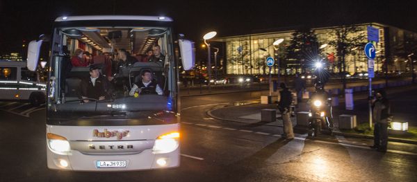 A bus carrying refugees with asylum status in Germany leaves the chancellery in Berlin on January 14, 2016, after it arrived from the Bavarian city of Landshut. . The bus carrying 31 refugees took them to a hotel where they will be able to spend the night before going to the destination of their choice A bus carrying refugees with asylum status in Germany leaves the chancellery in Berlin on January 14, 2016, after it arrived from the Bavarian city of Landshut. . The bus carrying 31 refugees took them to a hotel where they will be able to spend the night before going to the destination of their choice - Sputnik International