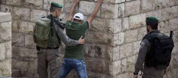 In this Friday, Oct. 23, 2015 file photo, an Israeli border police officer searches a Palestinian man at the Damascus Gate of Jerusalem's Old City ahead of Friday prayers - Sputnik International