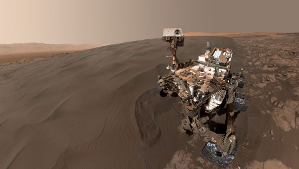 This Image obtained January 31, 2016 from NASA shows a self-portrait of NASA's Curiosity Mars rover vehicle at Namib Dune, where the rover's activities included scuffing into the dune with a wheel and scooping samples of sand for laboratory analysis. - Sputnik International