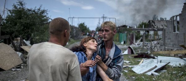 Local residents in the village of Luganskaya after the Ukrainian armed forces' air attack. File photo Local residents in the village of Luganskaya after the Ukrainian armed forces' air attack. File photo - Sputnik International