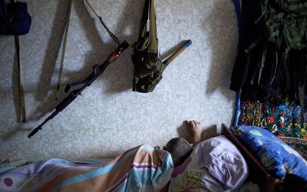 A member of a rapid response unit rests in a barrack before a curfew patrol in Lugansk A member of a rapid response unit rests in a barrack before a curfew patrol in Lugansk - Sputnik International