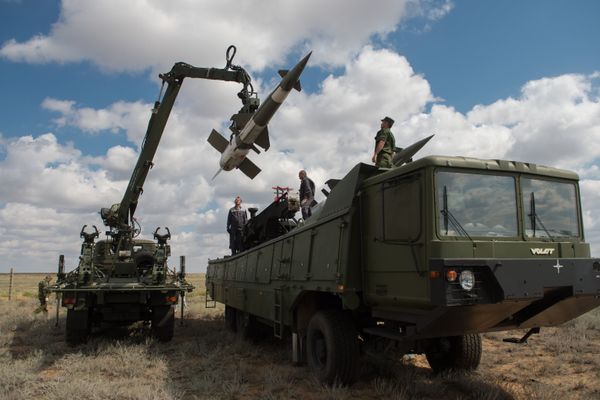 Servicemen load a Pechora-2M air defense complex of the Tajikistan armed forces during the 2013 Combat Commonwealth, a military drill for the CIS joint air defense system, at the Ashuluk training ground Servicemen load a Pechora-2M air defense complex of the Tajikistan armed forces during the 2013 Combat Commonwealth, a military drill for the CIS joint air defense system, at the Ashuluk training ground - Sputnik International