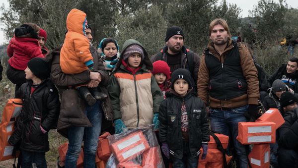 Migrants wait to travel to Greek island of Lesbos, near the Aegean town of Ayvacik, Turkey, Friday, Jan. 29, 2016 Migrants wait to travel to Greek island of Lesbos, near the Aegean town of Ayvacik, Turkey, Friday, Jan. 29, 2016 - Sputnik International