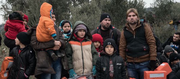 Migrants wait to travel to Greek island of Lesbos, near the Aegean town of Ayvacik, Turkey, Friday, Jan. 29, 2016 Migrants wait to travel to Greek island of Lesbos, near the Aegean town of Ayvacik, Turkey, Friday, Jan. 29, 2016 - Sputnik International