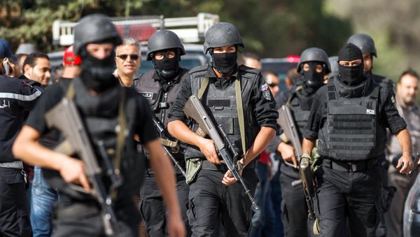 Members of the Tunisian National Guard take positions as they secure the scene of a shooting in the Oued Ellil suburb of Tunis, Tunisia, Thursday, Oct. 23, 2014 Members of the Tunisian National Guard take positions as they secure the scene of a shooting in the Oued Ellil suburb of Tunis, Tunisia, Thursday, Oct. 23, 2014 - Sputnik International