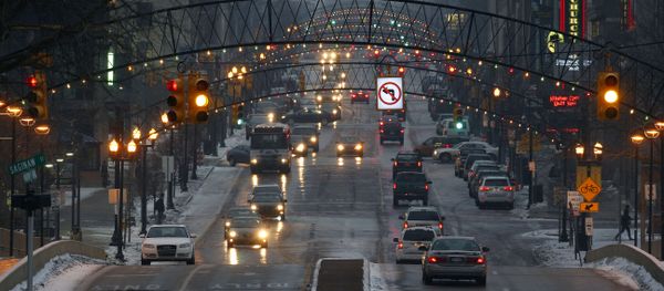 FILE - Vehicles drive through downtown Flint, Mich., on Jan. 21, 2016. From its founding, Flint's fortunes essentially were entwined with a single industry. First it was the fur trade, which shifted to lumber, which gave way to the horse carriages that led to it being called Vehicle City. It was a fitting moniker for its next, most important role, as a powerhouse of auto manufacturing and the original home of General Motors. FILE - Vehicles drive through downtown Flint, Mich., on Jan. 21, 2016. From its founding, Flint's fortunes essentially were entwined with a single industry. First it was the fur trade, which shifted to lumber, which gave way to the horse carriages that led to it being called Vehicle City. It was a fitting moniker for its next, most important role, as a powerhouse of auto manufacturing and the original home of General Motors. - Sputnik International