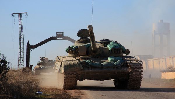 Syrian government forces' tanks drive in the village of Tal Jabin, north of the embattled city of Aleppo, as they advanced to break a three-year rebel siege of two government-held Shiite villages, Nubol and Zahraa, and take control of parts of the supply route on February 3, 2016 - Sputnik International