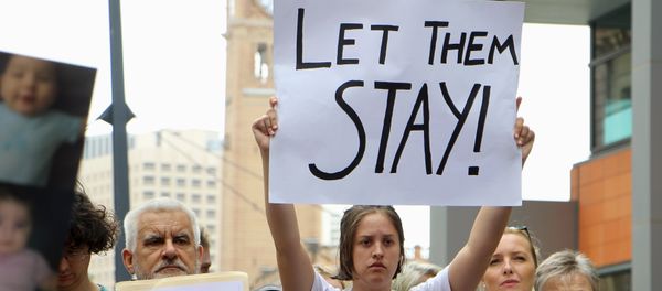 Activists hold placards and chant slogans as they protest outside the offices of the Australian Immigration Department in Sydney, Australia, February 4, 2016 Activists hold placards and chant slogans as they protest outside the offices of the Australian Immigration Department in Sydney, Australia, February 4, 2016 - Sputnik International