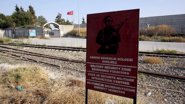 A Turkish military warning sign, with the closed Karkamis border gate in the background, is pictured in Karkamis, bordering with the Islamic State-held Syrian town of Jarablus, in Gaziantep province, Turkey, in this August 1, 2015 file photo A Turkish military warning sign, with the closed Karkamis border gate in the background, is pictured in Karkamis, bordering with the Islamic State-held Syrian town of Jarablus, in Gaziantep province, Turkey, in this August 1, 2015 file photo - Sputnik International