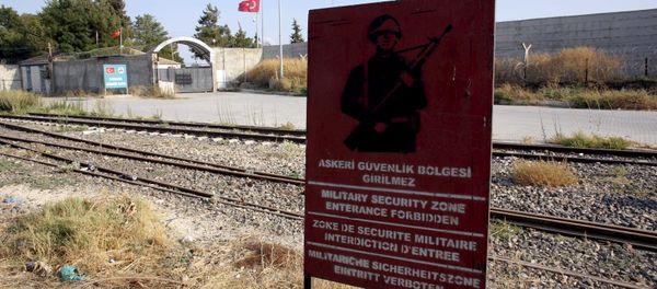 A Turkish military warning sign, with the closed Karkamis border gate in the background, is pictured in Karkamis, bordering with the Islamic State-held Syrian town of Jarablus, in Gaziantep province, Turkey, in this August 1, 2015 file photo A Turkish military warning sign, with the closed Karkamis border gate in the background, is pictured in Karkamis, bordering with the Islamic State-held Syrian town of Jarablus, in Gaziantep province, Turkey, in this August 1, 2015 file photo - Sputnik International