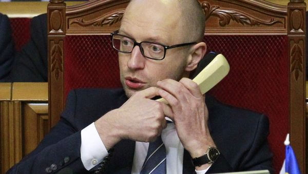 In this file photo taken on Friday, Dec. 11, 2015, Prime Minister of Ukraine, Arseniy Yatsenuk, speaks on the phone in Parliament in Kiev, Ukraine. Ukrainian Prime Minister Arseniy Yatsenyuk said on Friday, Dec. 18, 2015 - Sputnik International