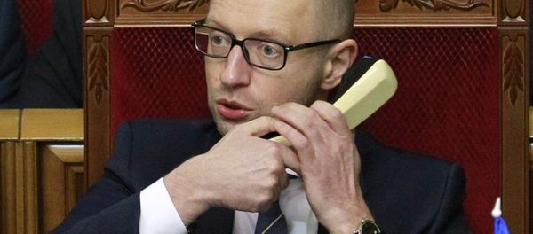 In this file photo taken on Friday, Dec. 11, 2015, Prime Minister of Ukraine, Arseniy Yatsenuk, speaks on the phone in Parliament in Kiev, Ukraine. Ukrainian Prime Minister Arseniy Yatsenyuk said on Friday, Dec. 18, 2015 - Sputnik International