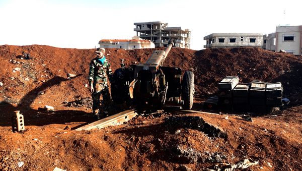 A soldier of the Syrian army stands by a gun during an assault on the town of Osman in Syria's province of Daraa A soldier of the Syrian army stands by a gun during an assault on the town of Osman in Syria's province of Daraa - Sputnik International