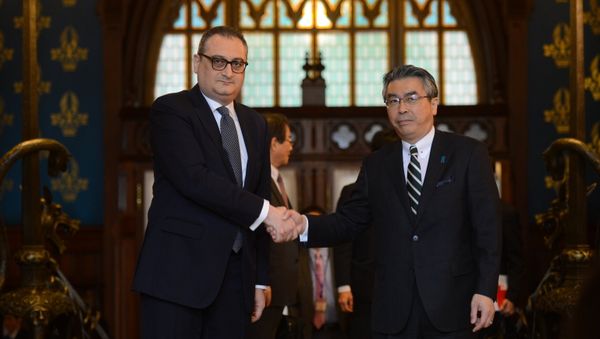 Deputy Minister of Foreign Affairs of Russia Igor Morgulov, left, and his Japanese counterpart Shinsuke Sugiyama shake hands during their meeting in Moscow Deputy Minister of Foreign Affairs of Russia Igor Morgulov, left, and his Japanese counterpart Shinsuke Sugiyama shake hands during their meeting in Moscow - Sputnik International