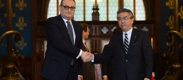 Deputy Minister of Foreign Affairs of Russia Igor Morgulov, left, and his Japanese counterpart Shinsuke Sugiyama shake hands during their meeting in Moscow Deputy Minister of Foreign Affairs of Russia Igor Morgulov, left, and his Japanese counterpart Shinsuke Sugiyama shake hands during their meeting in Moscow - Sputnik International