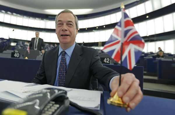 Nigel Farage, leader of the United Kingdom Independence Party (UKIP) and Member of the European Parliament, holds a British Union Jack flag as he arrives to take part in a debate on the upcoming summit and EU referendum in the UK, at the European Parliament in Strasbourg, France, February 3, 2016 - Sputnik International