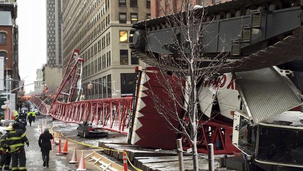 Emergency crews survey a massive construction crane collapse on a street in downtown Manhattan in New York, in a picture released by the New York City Fire Department on February 5, 2016. - Sputnik International