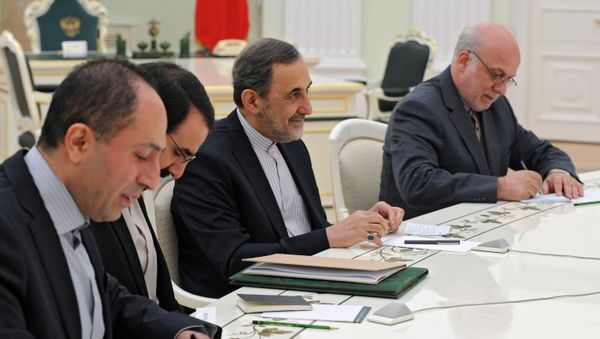 Vladimir Putin (outside frame) meets with Ali Akbar Velayati, Iranian president's special envoy and advisor for foreign affairs. File photo. - Sputnik International