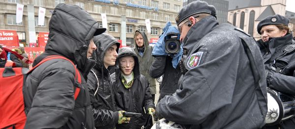 Police check toy guns during the start of the street carnival in Cologne, Germany Police check toy guns during the start of the street carnival in Cologne, Germany - Sputnik International