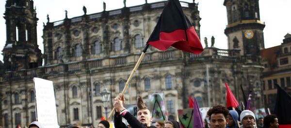 Opponents of the anti-Islam movement Patriotic Europeans Against the Islamisation of the West (PEGIDA) take part in a demonstration in Dresden, Germany - Sputnik International