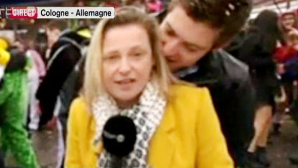 A screenshot of RTBF journalist Esmeralda Labye being groped in front of a live camera at Carnival in Cologne A screenshot of RTBF journalist Esmeralda Labye being groped in front of a live camera at Carnival in Cologne - Sputnik International