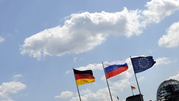 The Russian flag flutters between the flags of Germany (L) and Europe as in the background is seen the cupola of the Reichstag housing the Bundestag at the Chancellery in Berlin The Russian flag flutters between the flags of Germany (L) and Europe as in the background is seen the cupola of the Reichstag housing the Bundestag at the Chancellery in Berlin - Sputnik International