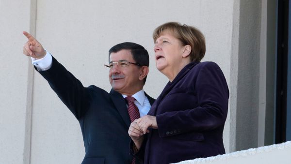 German Chancellor Angela Merkel, right, and Turkish Prime Minister Ahmet Davutoglu speak as they look towards the city center after a welcome ceremony in Ankara, Turkey, Monday, Feb. 8, 2016. German Chancellor Angela Merkel, right, and Turkish Prime Minister Ahmet Davutoglu speak as they look towards the city center after a welcome ceremony in Ankara, Turkey, Monday, Feb. 8, 2016. - Sputnik International