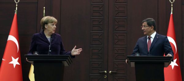 German Chancellor Angela Merkel, left, speaks to the media during a joint news conference with Turkish Prime Minister Ahmet Davutoglu in Ankara, Turkey, Monday, Feb. 8, 2016. German Chancellor Angela Merkel, left, speaks to the media during a joint news conference with Turkish Prime Minister Ahmet Davutoglu in Ankara, Turkey, Monday, Feb. 8, 2016. - Sputnik International