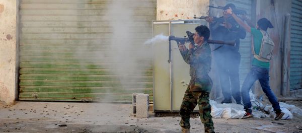 Libyan military soldiers fire their weapons during clashes with Islamic militias in Benghazi. Libya. (File) - Sputnik International