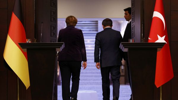 German Chancellor Angela Merkel (L) and Turkish Prime Minister Ahmet Davutoglu leave following a joint news conference in Ankara, Turkey February 8, 2016 German Chancellor Angela Merkel (L) and Turkish Prime Minister Ahmet Davutoglu leave following a joint news conference in Ankara, Turkey February 8, 2016 - Sputnik International