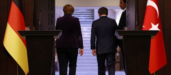 German Chancellor Angela Merkel (L) and Turkish Prime Minister Ahmet Davutoglu leave following a joint news conference in Ankara, Turkey February 8, 2016 German Chancellor Angela Merkel (L) and Turkish Prime Minister Ahmet Davutoglu leave following a joint news conference in Ankara, Turkey February 8, 2016 - Sputnik International