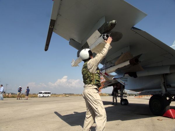 In this photo taken on Monday, Oct. 5, 2015, a Russian pilot fixes an air-to-air missile at his Su-30 jet fighter before a take off at Hmeimim airbase in Syria. In this photo taken on Monday, Oct. 5, 2015, a Russian pilot fixes an air-to-air missile at his Su-30 jet fighter before a take off at Hmeimim airbase in Syria. - Sputnik International