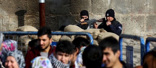 Turkish police stand guard one of the entrance of Sur district, which is partially under curfew, in the Kurdish-dominated southeastern city of Diyarbakir, Turkey January 29, 2016. Turkish police stand guard one of the entrance of Sur district, which is partially under curfew, in the Kurdish-dominated southeastern city of Diyarbakir, Turkey January 29, 2016. - Sputnik International