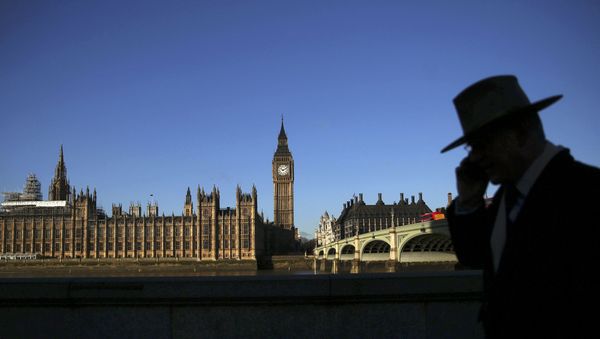 A man is silhouetted in front of the Houses of Parliament on a sunny winter's morning in London, Britain January 15, 2016. A man is silhouetted in front of the Houses of Parliament on a sunny winter's morning in London, Britain January 15, 2016. - Sputnik International