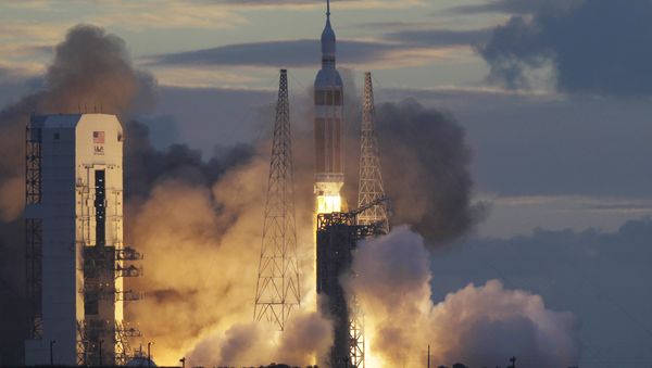 NASA Orion capsule on top of a Delta IV rocket lifts off on its first unmanned orbital test flight from Complex 37 B at the Cape Canaveral Air Force Station, Friday, Dec. 5, 2014 at Cape Canaveral, Fla - Sputnik International
