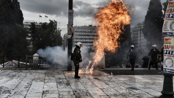A firebomb explodes beside a riot police member during a massive protest in Athens on February 4, 2016. A firebomb explodes beside a riot police member during a massive protest in Athens on February 4, 2016. - Sputnik International