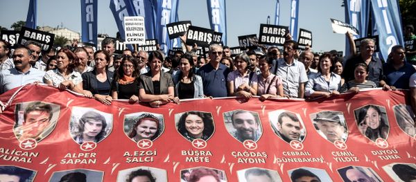 Protesters and members of Turkey's People's Democracy Party (HDP) hold a banner with pictures of the victims of the Suruc bomb attack after their peace march was banned by authorities in the Aksaray district of Istanbul on July 26 Protesters and members of Turkey's People's Democracy Party (HDP) hold a banner with pictures of the victims of the Suruc bomb attack after their peace march was banned by authorities in the Aksaray district of Istanbul on July 26 - Sputnik International