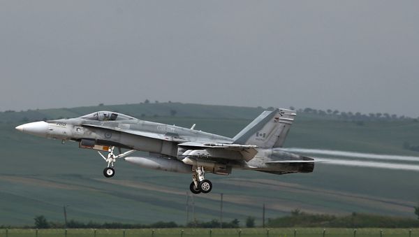 This file photo taken on May 28, 2014 shows a fighter type F-18 Hornet of the Canadian Royal Air Force taking off from the military airbase at Campia Turzii. Canada will end air strikes targeting the Islamic State group in Iraq and Syria and bring home its six fighter jets on February 22, the government announced February 8, 2016 This file photo taken on May 28, 2014 shows a fighter type F-18 Hornet of the Canadian Royal Air Force taking off from the military airbase at Campia Turzii. Canada will end air strikes targeting the Islamic State group in Iraq and Syria and bring home its six fighter jets on February 22, the government announced February 8, 2016 - Sputnik International
