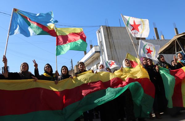 Kurdish women hold flags of the Kurdish People's Protection Units (YPG) political wing, the Democratic Union Party (PYD), and banners during a demonstration against the exclusion of Syrian-Kurds from the Geneva talks in the northeastern Syrian city of Qamishli on February 4, 2016 - Sputnik International